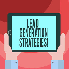 Text sign showing Lead Generation Strategies. Conceptual photo Initiation of consumer interest into products Hu analysis Hand Holding Blank Screen Tablet Smartphone Display Unit photo