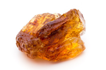 Brown caramelized sugar on white background.