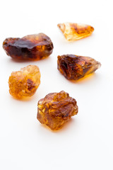 Brown caramelized sugar on white background.