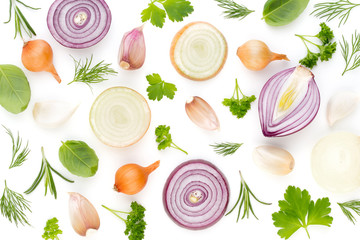 Onion and spices isolated on white background, top view. Wallpaper abstract composition of vegetables.
