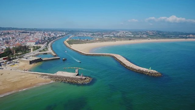 Aerial. Beautiful Portuguese beaches and shores of the city of Lagos. View from the sky, Algarve.