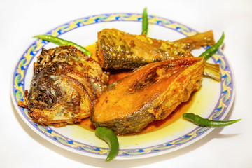 Deep fried Hilsa fish food with tasty fish oil used as a side dish with rice meal. A traditional Indian non vegetarian cuisine.