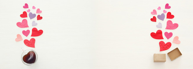 Valentine's day concept. Paper hearts over wooden white background. Flat lay.