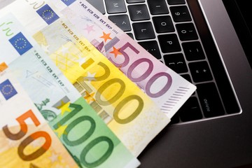 Background with american dollar and euro bills.