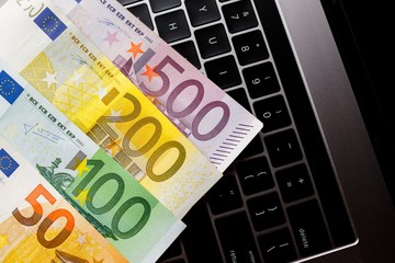 Background with american dollar and euro bills.