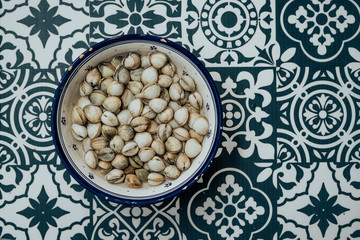 Cockles surrounded by blue and white background