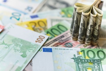 Background with american dollar and euro bills.
