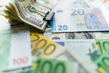 Background with american dollar and euro bills.