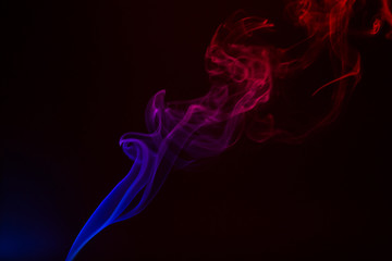 Colorful smoke close-up on a black background