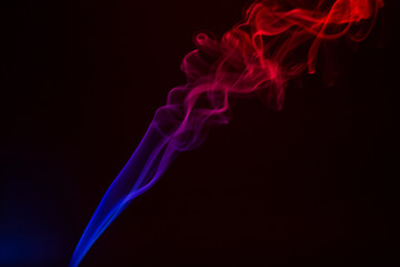 Colorful smoke close-up on a black background