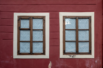 Window on the façade of a stone wall