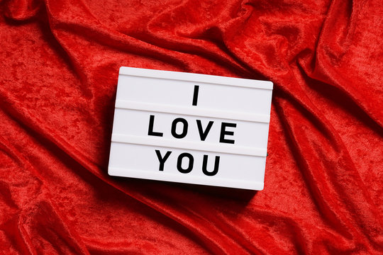 I love you text on lightbox or light box sign on red velvet background