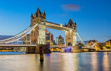 The Tower Bridge in London lights up in the Evening