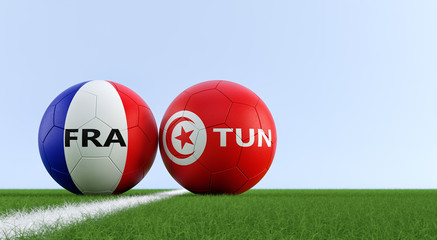 France vs. Tunisia Soccer Match - Soccer balls in France and Tunisia national colors on a soccer field. Copy space on the right side - 3D Rendering 