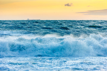 Fototapeta na wymiar in a storm, the waves hit the shore in Gelendzhik