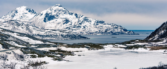A small frozen lake on the beach of Grøtfjord in Norway