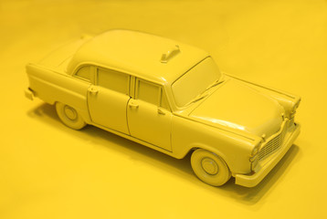 miniture yellow taxi cab