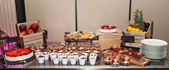 Variety of delicious arranged party dessert food - cake buffet