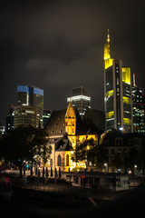St. Leonhard is a Catholic church and parish in Frankfurt am Main, surrounded by skyscrapers at night. Germany