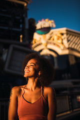USA, Nevada, Las Vegas, portrait of happy young woman in the city at night