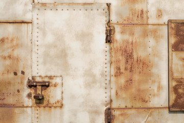 Rusty metal garage door with lock