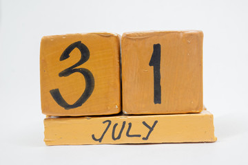 july 31st. Day 31 of month, handmade wood calendar isolated on white background. summer month, day of the year concept