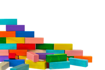 Ruined wall from colorful wooden blocks isolated on white background