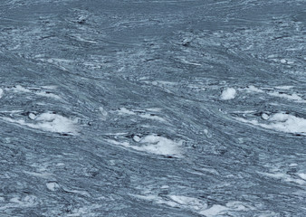 Textured grey marble stone with white streaks