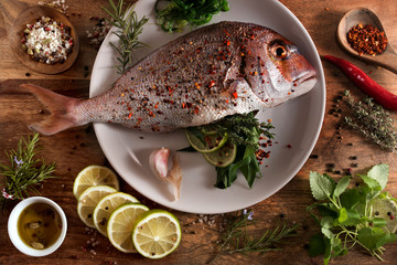 Fresh raw fish with spices and herbs