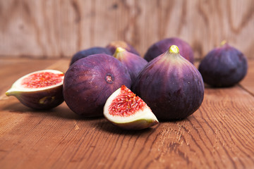 Fresh fruits, figs on the wooden background.