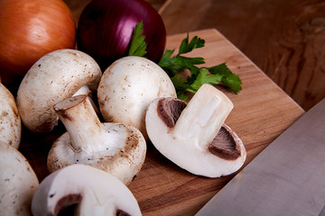  Fresh mushrooms on a wooden background.
