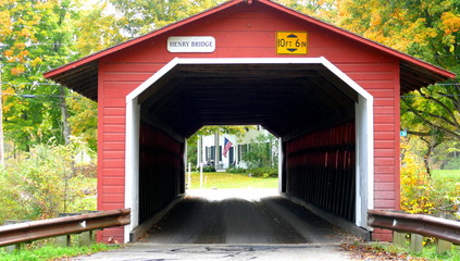 Beautiful little red covered bridge in New Hampshire during Fall season