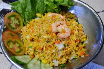 Rice with seafood, salad and tomatoes