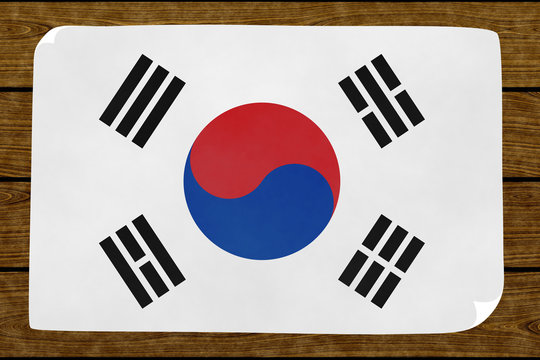 Illustration of a South Koreas´s flag painted on the papier pasted on the woody wall
