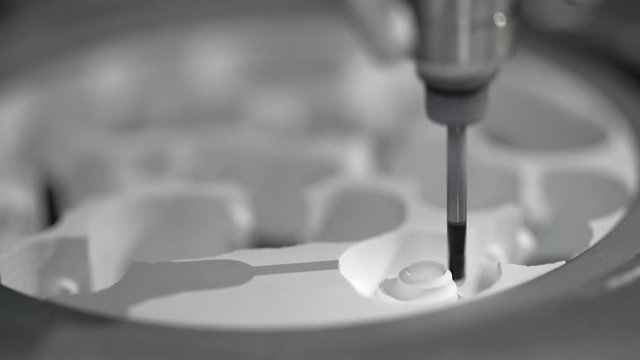 Closeup view at carving process in dental milling machine