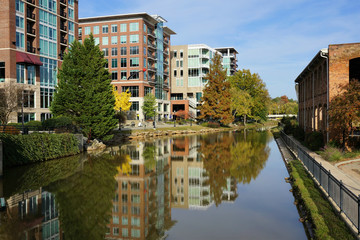 Fototapeta na wymiar Greenville cityscape - buildings reflecting in Reedy River