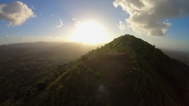 Peak mountain green slopes, dawn on the horizon, the sunrise / Peak mountain green slopes, dawn on the horizon, the sunrise. Summer in the mountains. Top of the mountain, mountain range