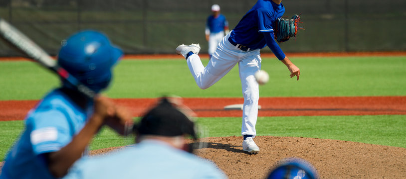 Pitcher and third baseman during a baseball game - Powered by Adobe