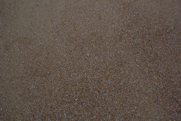 Fototapeta na wymiar Textured wet sand background