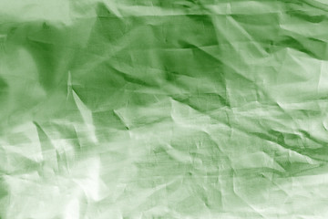 Elegant green textile background. Silk cloth texture. Fabric pattern.