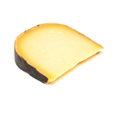 Mature Dutch Gouda cheese isolated on a white studio background.