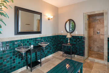 Luxury spa bathroom with limestone tile and shower.