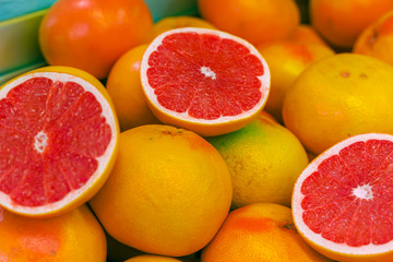 Exotic  red grapefruit. Cut in a half. Selective focus.