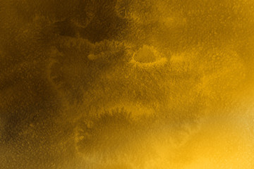 Gold luxury ink and watercolor textures on white paper background. Paint leaks and ombre effects. Hand painted vintage texture.