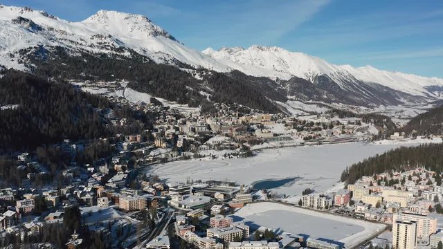 Aerial View Of St. Moritz In Winter, Famous Ski Resort Town In Swiss Alps Mountains, Snow On Slopes, Sunny Day With Blue Sky - Landscape Panorama Of Switzerland, Europe