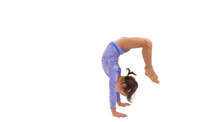 Little gymnast on a white background. Sporting exercise, stretch, flexibility, aerobics