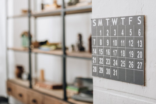 selective focus of wall calendar showing dates at living room