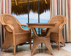 paradise hotel window palm tree furniture rattan