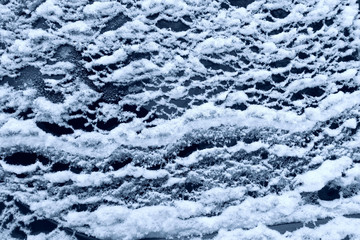frozen glass of a car on a winter day