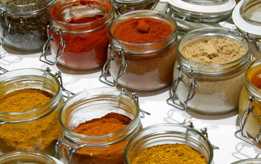 jars with oriental spices such as curry pepper piucante paprika